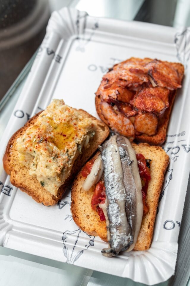 Photo by Alex Quezada a white tray topped with different types of food